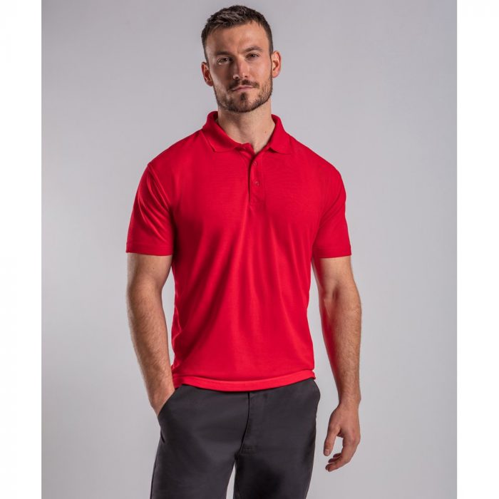 A man modelling a red polo shirt.