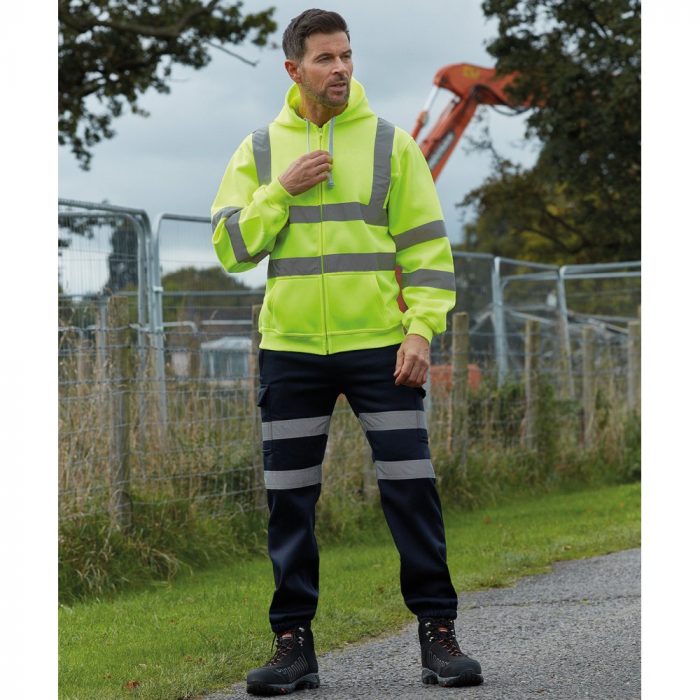 A man in hi-vis apparel at a work site.